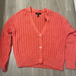 Loose pink knit sweater